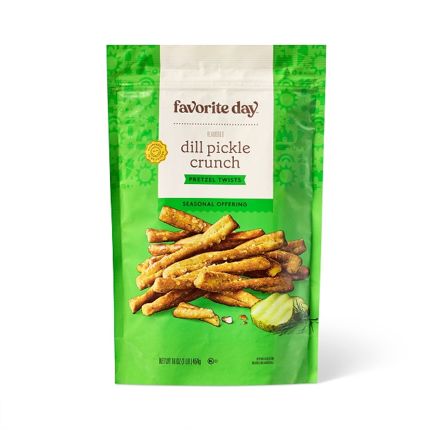 A bag of Favorite Day Dill Pickle Crunch Pretzel Twists with a green background and scattered pretzels.